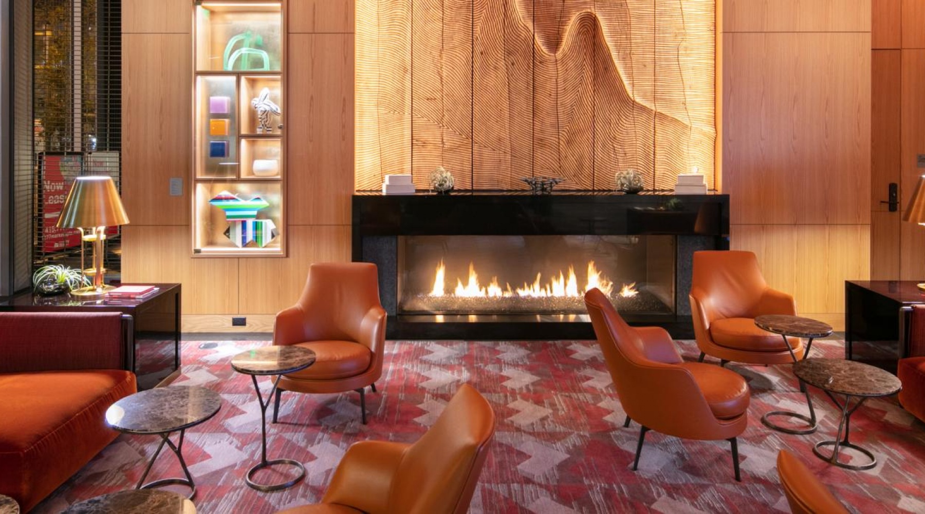 Everything within reach a room with a fireplace, wooden accents, and chairs