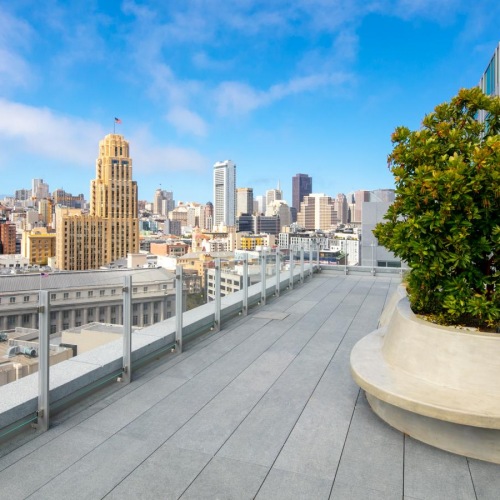 The essence of exceptional living outside patio with landsscaping and views of the nearby city